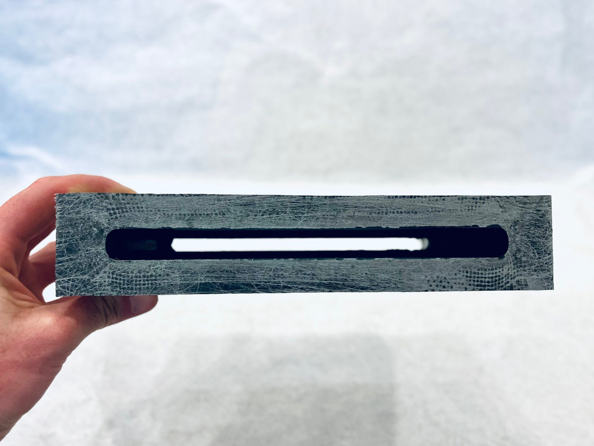 Adjustable Tuttle Box V4 held in hand, view of mast slot