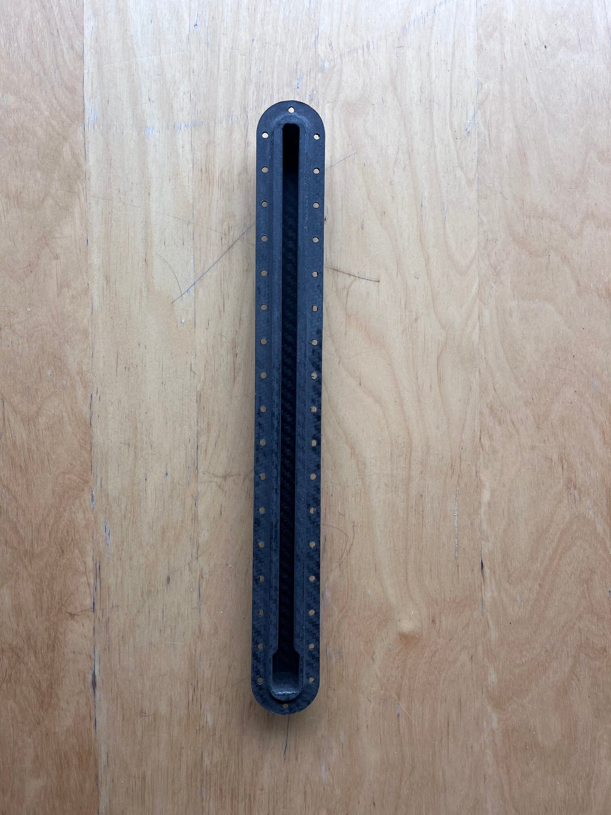 Carbon fiber hydrofoil track, top view of track opening