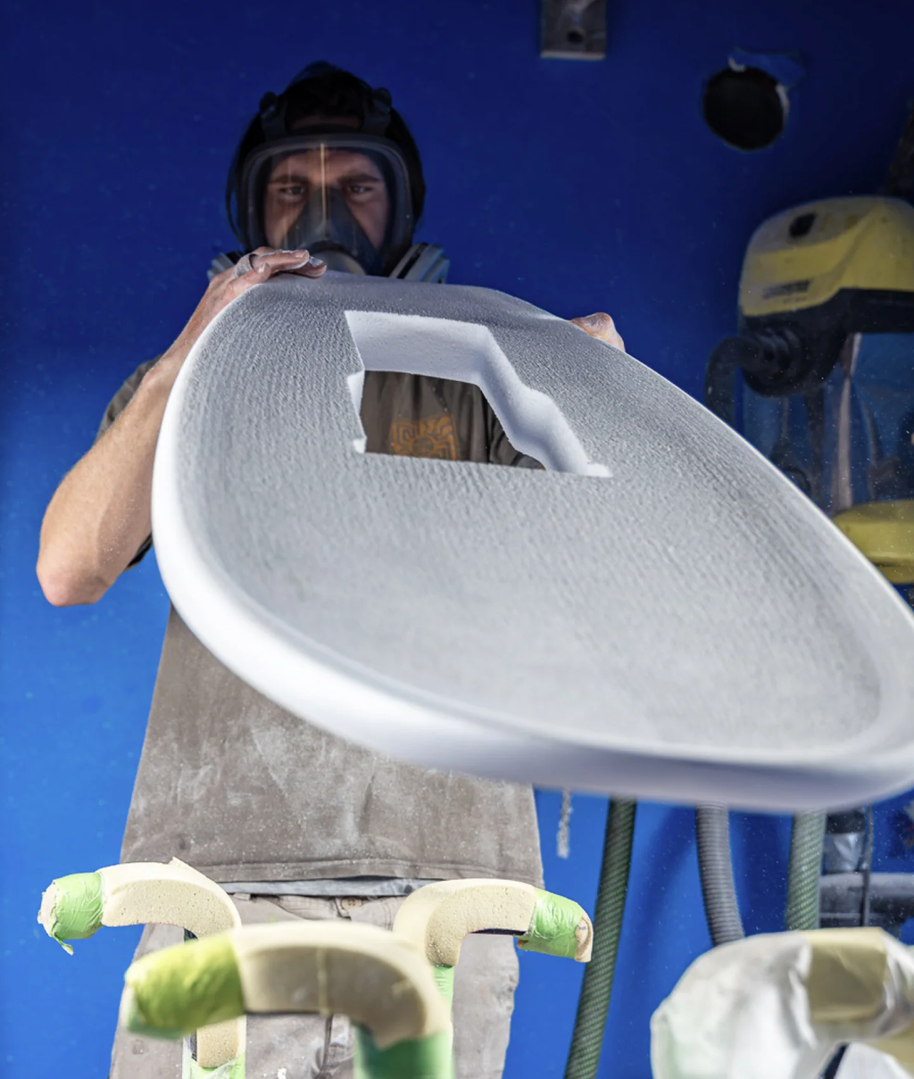 Shaper working on a foil board build with RIIFT Tracks